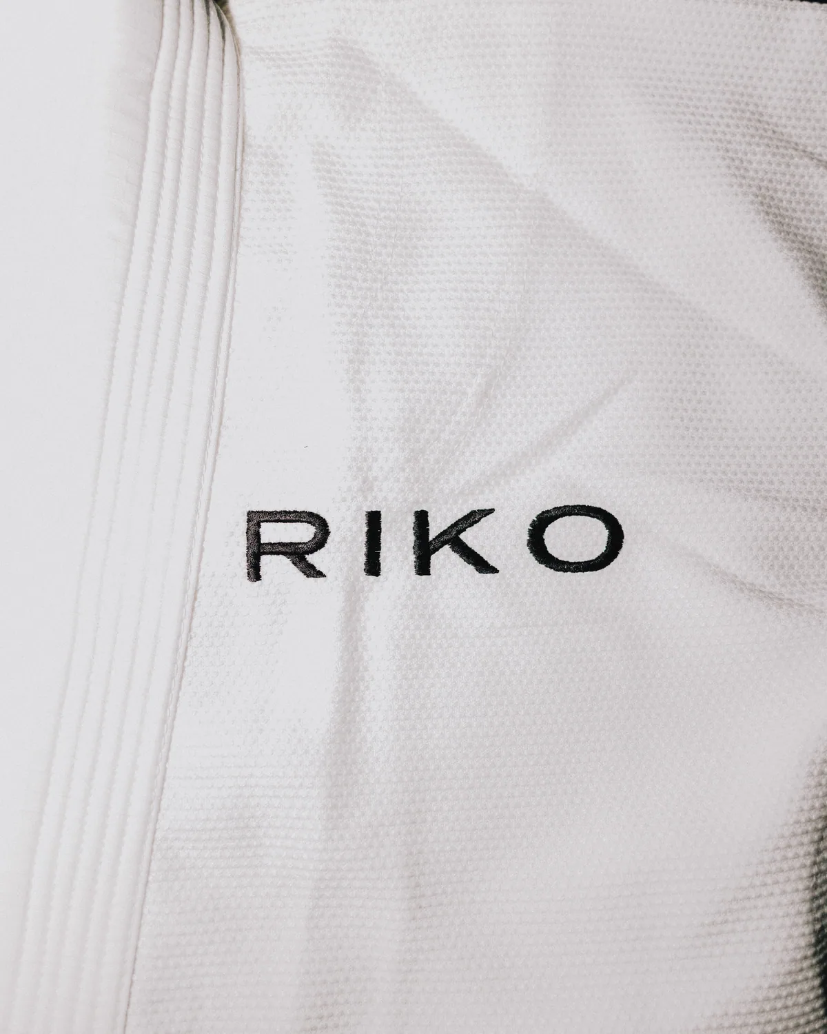 Kimono · Salt, RIKO wordmark on the pearl weave