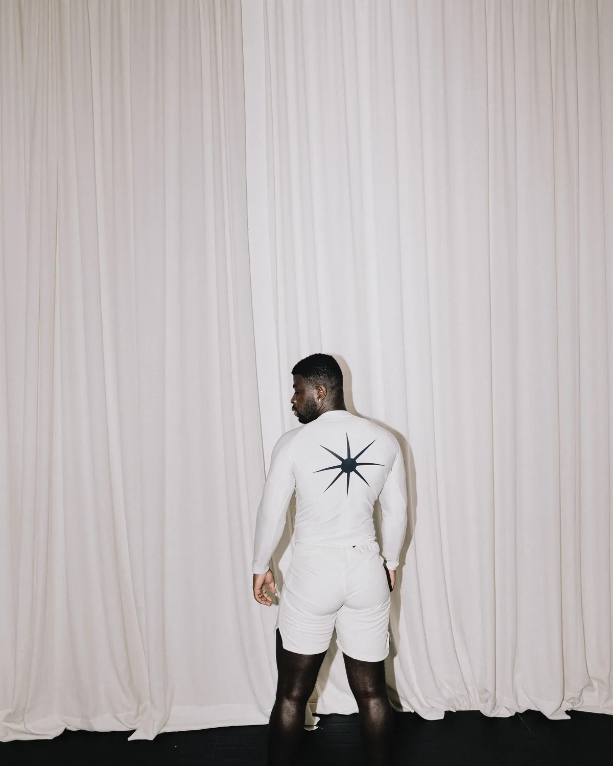 Rashguard · Sand, back, sea urchin between the shoulder blades